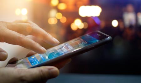 Fingers touching a smartphone