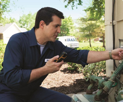 Technician in the field using a mobile device