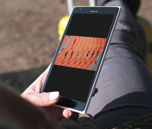 A hand holding a mobile phone.
